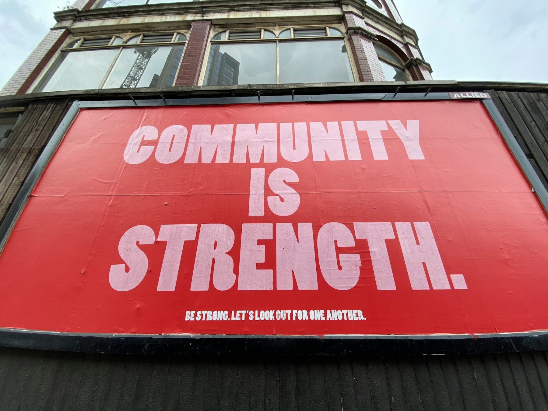 Bill board saying Community is Strength